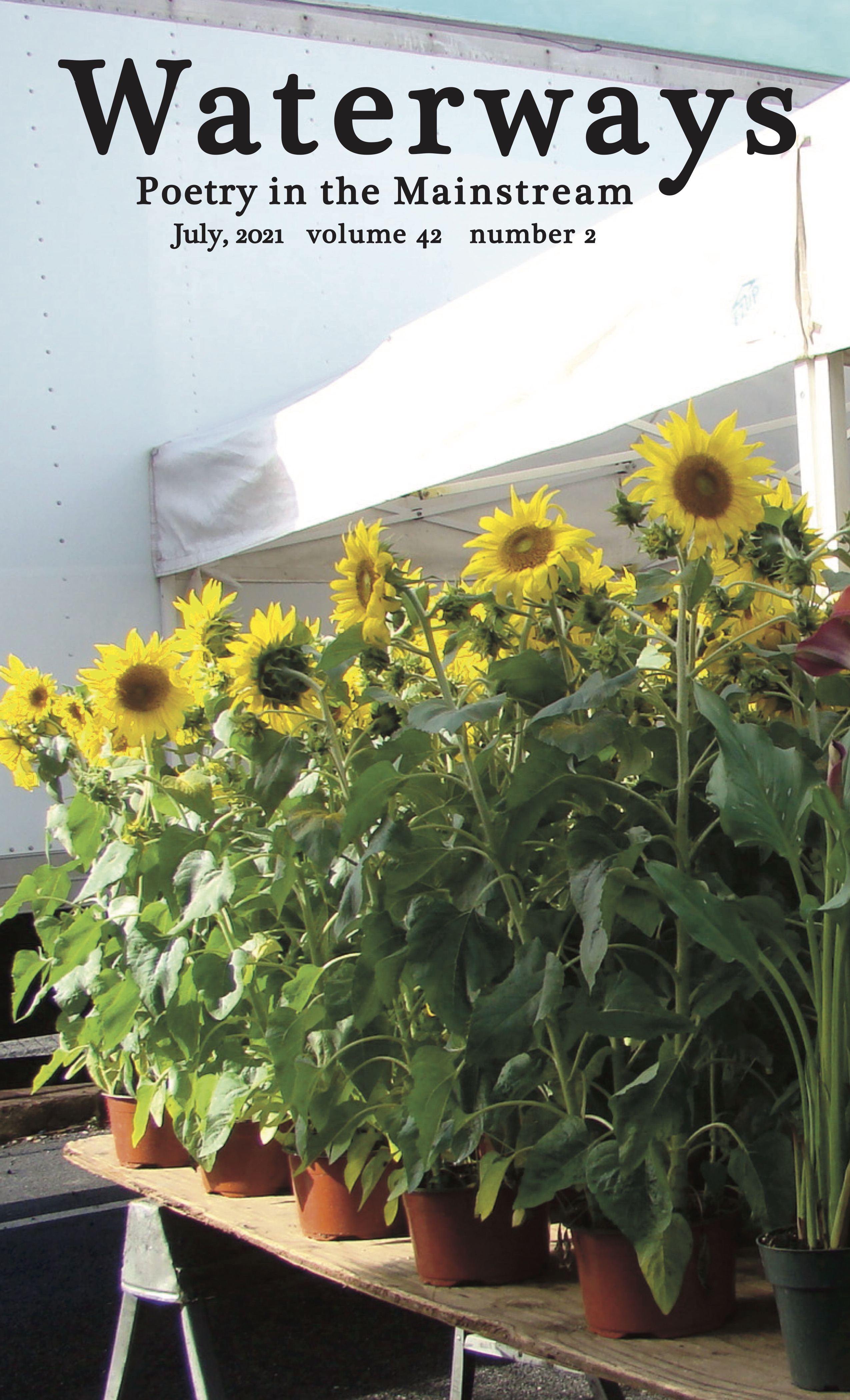 Cover for July shows Sunflowers for sale at the farmer's market